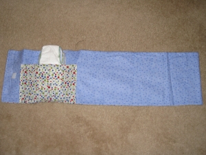 Unrolled - inside pocket holds wipes and diapers.  Flannel lined inside so baby's bummy is comfy!